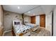 Charming basement bedroom with twin beds and cork accent wall at 7722 W 1St Pl, Lakewood, CO 80226
