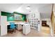 Basement office with a large desk and built-in shelving at 7722 W 1St Pl, Lakewood, CO 80226