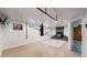 Spacious basement with a fireplace and home gym setup at 7722 W 1St Pl, Lakewood, CO 80226