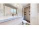 Modern bathroom with a walk-in shower and updated vanity at 7722 W 1St Pl, Lakewood, CO 80226