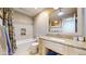 Clean bathroom with a bathtub, shower, and granite vanity at 7722 W 1St Pl, Lakewood, CO 80226