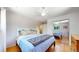 Spacious bedroom with a large bed and mirrored closet doors at 7722 W 1St Pl, Lakewood, CO 80226