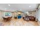 Open concept dining area with hardwood floors and access to the kitchen at 7722 W 1St Pl, Lakewood, CO 80226