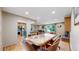 Open concept dining area with hardwood floors and view to kitchen at 7722 W 1St Pl, Lakewood, CO 80226