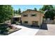 Two-story house with a landscaped yard and attached garage at 7722 W 1St Pl, Lakewood, CO 80226