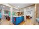Kitchen with stainless steel appliances and a blue island at 7722 W 1St Pl, Lakewood, CO 80226
