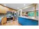 Modern kitchen with stainless steel appliances and blue cabinetry at 7722 W 1St Pl, Lakewood, CO 80226