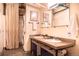 Modern bathroom featuring double sinks, concrete countertops, and a combination washer and dryer at 1777 E 39Th Ave # 209, Denver, CO 80205