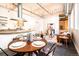 Inviting living space with exposed ductwork, hardwood floors, open layout, and natural light at 1777 E 39Th Ave # 209, Denver, CO 80205