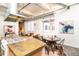 Bright open concept living space with modern kitchen island and exposed ductwork at 1777 E 39Th Ave # 209, Denver, CO 80205