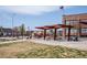 A dog-friendly community space, featuring walkways, an open lawn and shaded seating at 1777 E 39Th Ave # 209, Denver, CO 80205