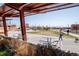 An open community space featuring covered seating, a bridge and sidewalks for enjoying the outdoors at 1777 E 39Th Ave # 209, Denver, CO 80205