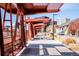 A charming walkway, featuring a shaded structure and comfortable seating, offers a inviting atmosphere at 1777 E 39Th Ave # 209, Denver, CO 80205