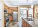 Modern kitchen featuring stainless steel appliances and a large island with a sink at 1200 Cherokee St # 106, Denver, CO 80204