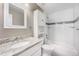 Bathroom featuring a granite vanity and a tiled shower-tub combo at 10001 E Evans Ave # D, Aurora, CO 80247
