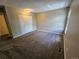 A cozy bedroom with neutral colors, closet space, and plush carpeting at 10001 E Evans Ave # D, Aurora, CO 80247