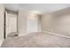 Neutral bedroom features carpeted floors, double door closet, and overhead lighting at 10001 E Evans Ave # D, Aurora, CO 80247