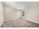 Standard bedroom featuring neutral walls, carpeted floors, and a window for natural light at 10001 E Evans Ave # D, Aurora, CO 80247