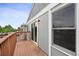 Wooden deck adjacent to the property's siding and sliding glass door at 10001 E Evans Ave # D, Aurora, CO 80247