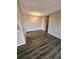 View of open dining area featuring modern wood flooring and contemporary chandelier at 10001 E Evans Ave # D, Aurora, CO 80247