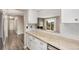 Open concept kitchen with granite counters, and access to living room at 10001 E Evans Ave # D, Aurora, CO 80247