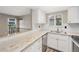 Bright kitchen features granite countertops, white cabinets and subway tile backsplash at 10001 E Evans Ave # D, Aurora, CO 80247