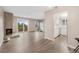 Bright living area open to kitchen with stone fireplace and balcony at 10001 E Evans Ave # D, Aurora, CO 80247