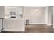 Open living area with dining space and modern kitchen at 10001 E Evans Ave # D, Aurora, CO 80247