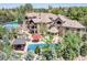 Expansive property with a pool, tennis court, stone patio, and mature trees at 5650 E Stanford Dr, Cherry Hills Village, CO 80111