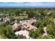 Expansive aerial view of property highlighting the home, pool, tennis court, and grounds at 5650 E Stanford Dr, Cherry Hills Village, CO 80111
