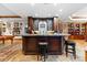 The bar features a stone countertop and is surrounded by stone accents and sports memorabilia at 5650 E Stanford Dr, Cherry Hills Village, CO 80111