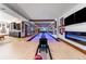 This bowling alley has custom woodwork, recessed lighting, and decoratively framed artwork at 5650 E Stanford Dr, Cherry Hills Village, CO 80111