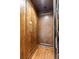 An elegant wood-paneled elevator with call buttons allows easy navigation between floors in style at 5650 E Stanford Dr, Cherry Hills Village, CO 80111
