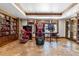 This game room boasts multiple arcade games, stone accents, and memorabilia displays at 5650 E Stanford Dr, Cherry Hills Village, CO 80111