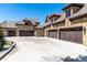 Spacious multi-car garage with stone exterior and ample driveway space, perfect for car enthusiasts at 5650 E Stanford Dr, Cherry Hills Village, CO 80111