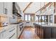 Bright, open kitchen with a large island, modern appliances, and expansive countertops for cooking and entertaining at 5650 E Stanford Dr, Cherry Hills Village, CO 80111