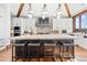 Gourmet kitchen with a large island, stainless steel appliances, and custom cabinetry at 5650 E Stanford Dr, Cherry Hills Village, CO 80111