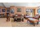 Cozy living room features leather furniture, a large chess set, and natural light at 5650 E Stanford Dr, Cherry Hills Village, CO 80111