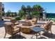 Outdoor sitting area with a fire pit, grill, and mature landscaping is perfect for entertaining at 5650 E Stanford Dr, Cherry Hills Village, CO 80111