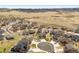 Aerial view of a suburban neighborhood featuring homes with well-kept lawns and landscaping at 5998 Berry Ridge Way, Castle Rock, CO 80104