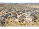 Aerial view of a residential area featuring well-maintained homes, green spaces, and community roadways at 5998 Berry Ridge Way, Castle Rock, CO 80104