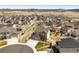 Aerial view of a suburban neighborhood featuring a home with a fenced yard and long driveway at 5998 Berry Ridge Way, Castle Rock, CO 80104