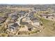 Aerial view of a neighborhood, showing a mix of modern homes, cul-de-sacs, and green spaces at 5998 Berry Ridge Way, Castle Rock, CO 80104