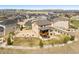Areal view of two-story home featuring a spacious backyard with white picket fence in a Gathering-friendly neighborhood at 5998 Berry Ridge Way, Castle Rock, CO 80104