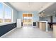 Open-concept basement featuring a walk-out patio, a refrigerator, and dry bar in the entertaining space at 5998 Berry Ridge Way, Castle Rock, CO 80104