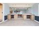 Finished basement with a dry bar area and a pool table for entertaining and a view to the backyard at 5998 Berry Ridge Way, Castle Rock, CO 80104