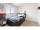 Cozy bedroom featuring a comfortable bed, window views, and a minimalist design at 5998 Berry Ridge Way, Castle Rock, CO 80104