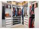 Walk-in closet offers custom shelving and drawers for optimal organization and storage at 5998 Berry Ridge Way, Castle Rock, CO 80104