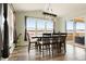 Dining room with modern lighting and a large window with sliding glass door at 5998 Berry Ridge Way, Castle Rock, CO 80104