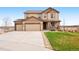 Well-maintained two-story home boasts mature landscaping and a three-car garage at 5998 Berry Ridge Way, Castle Rock, CO 80104